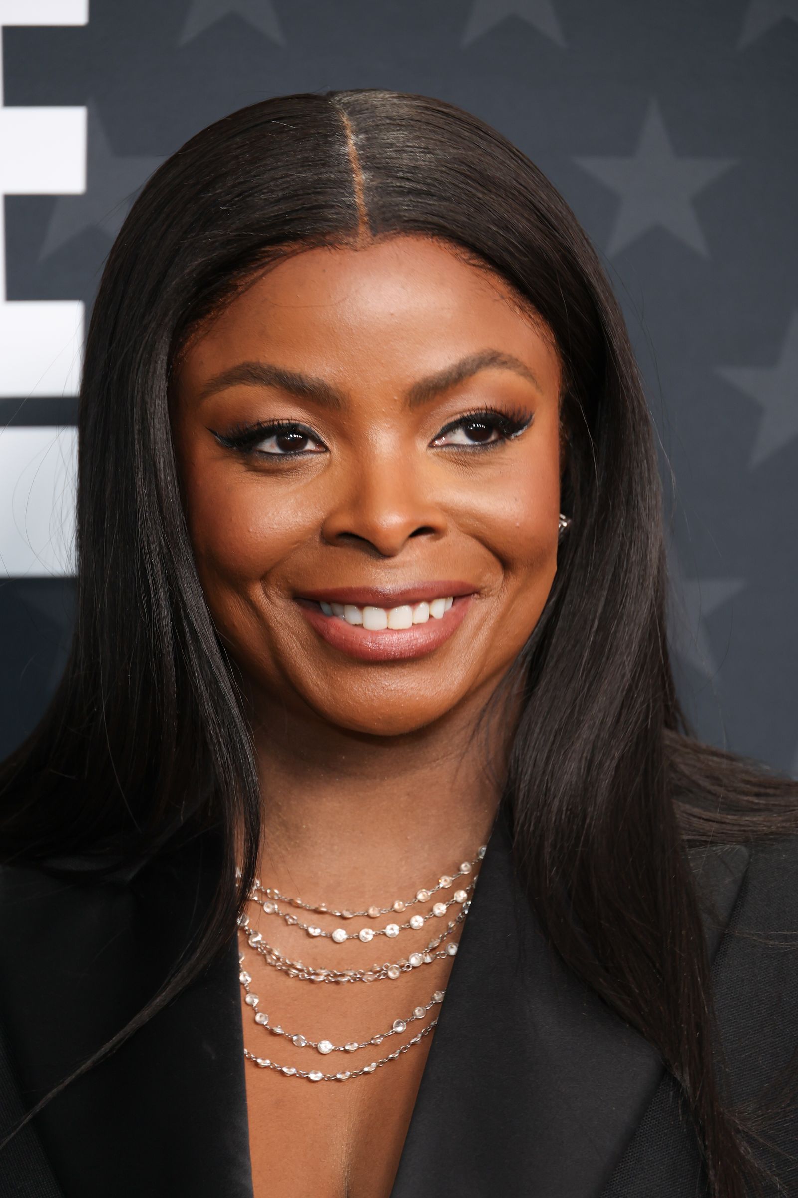 Image may contain heads, faces, dimples, body parts, neck accessories, jewelry necklaces, adult happiness and smiles