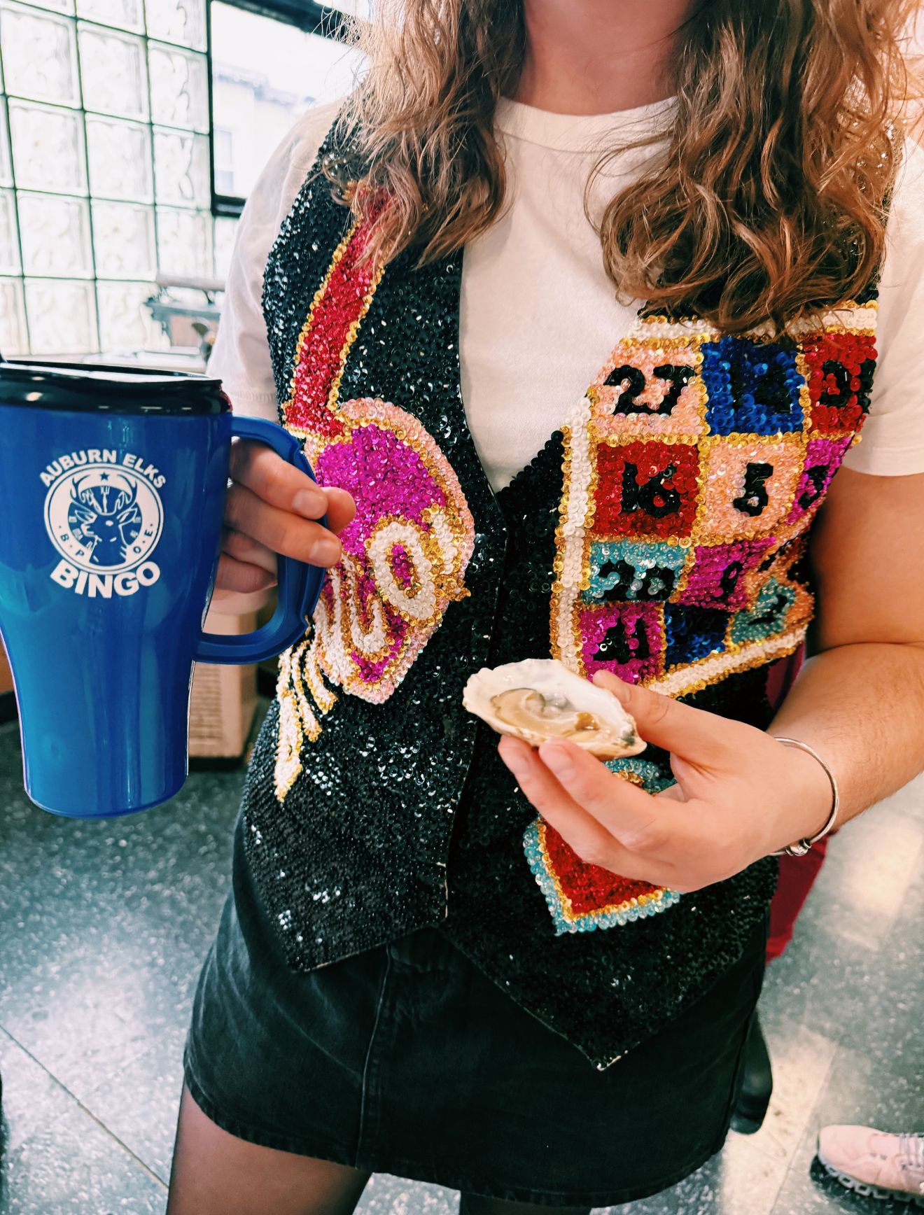 Image may contain adult cup beachwear and shirt sleeves