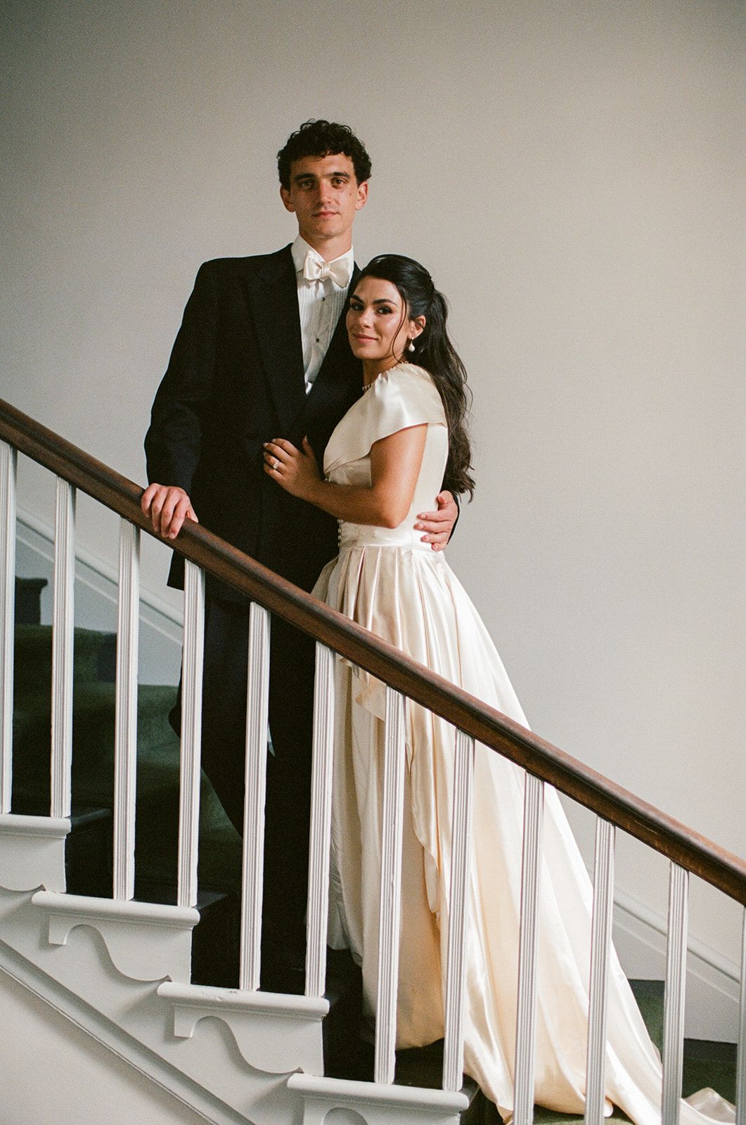 Image may contain blazers, coats, formal suits, buildings, houses and stairs