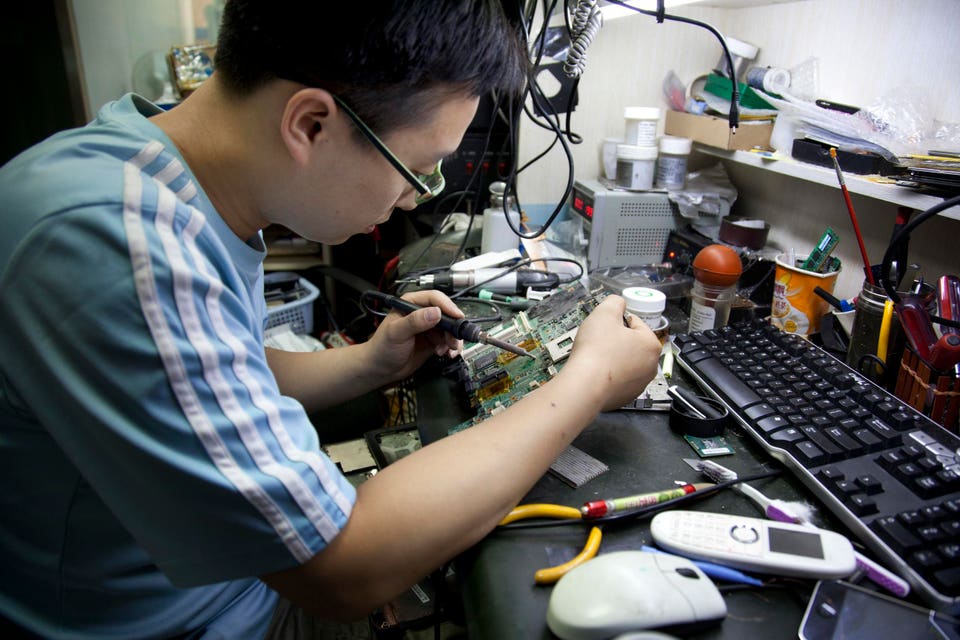 China - Beijing - Repair of computer circuit boards at Zhongguancun Science and Technology Center in Haidian District