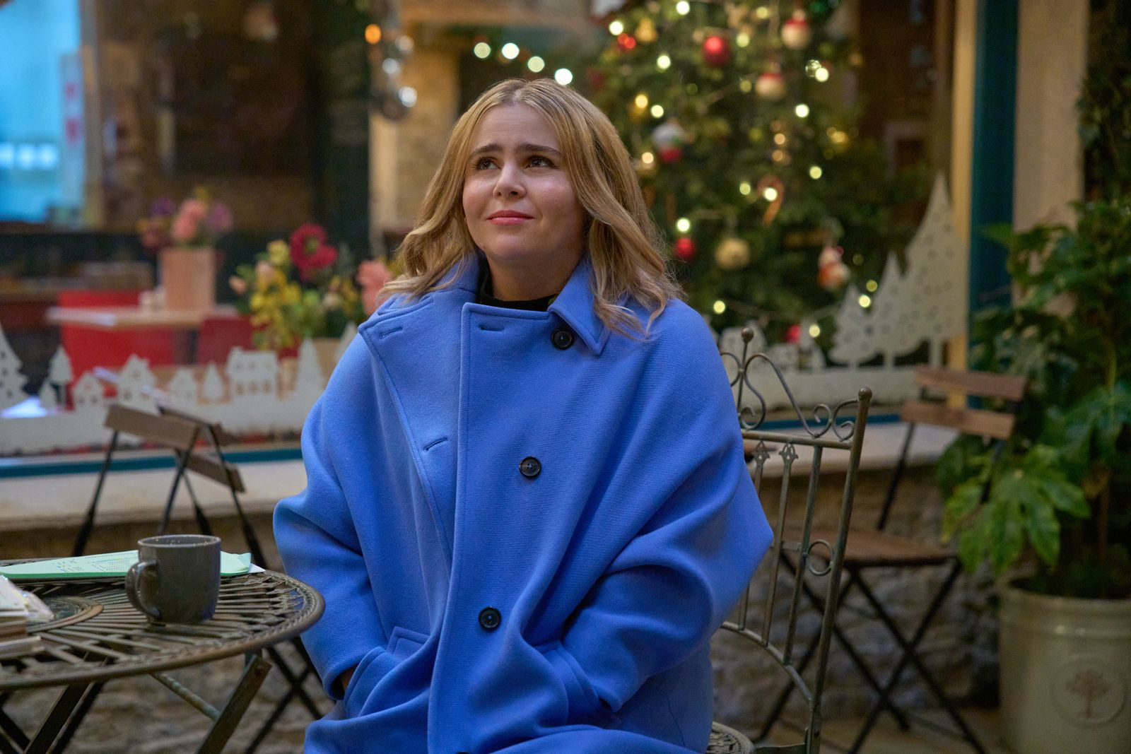Image may contain Mae Whitman Clothing Coat Blonde Hair Person Adult Face Happy Head Smile and Photography