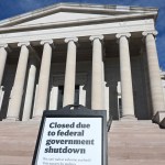 On the exterior wall of the classical-style museum, a partition reads 