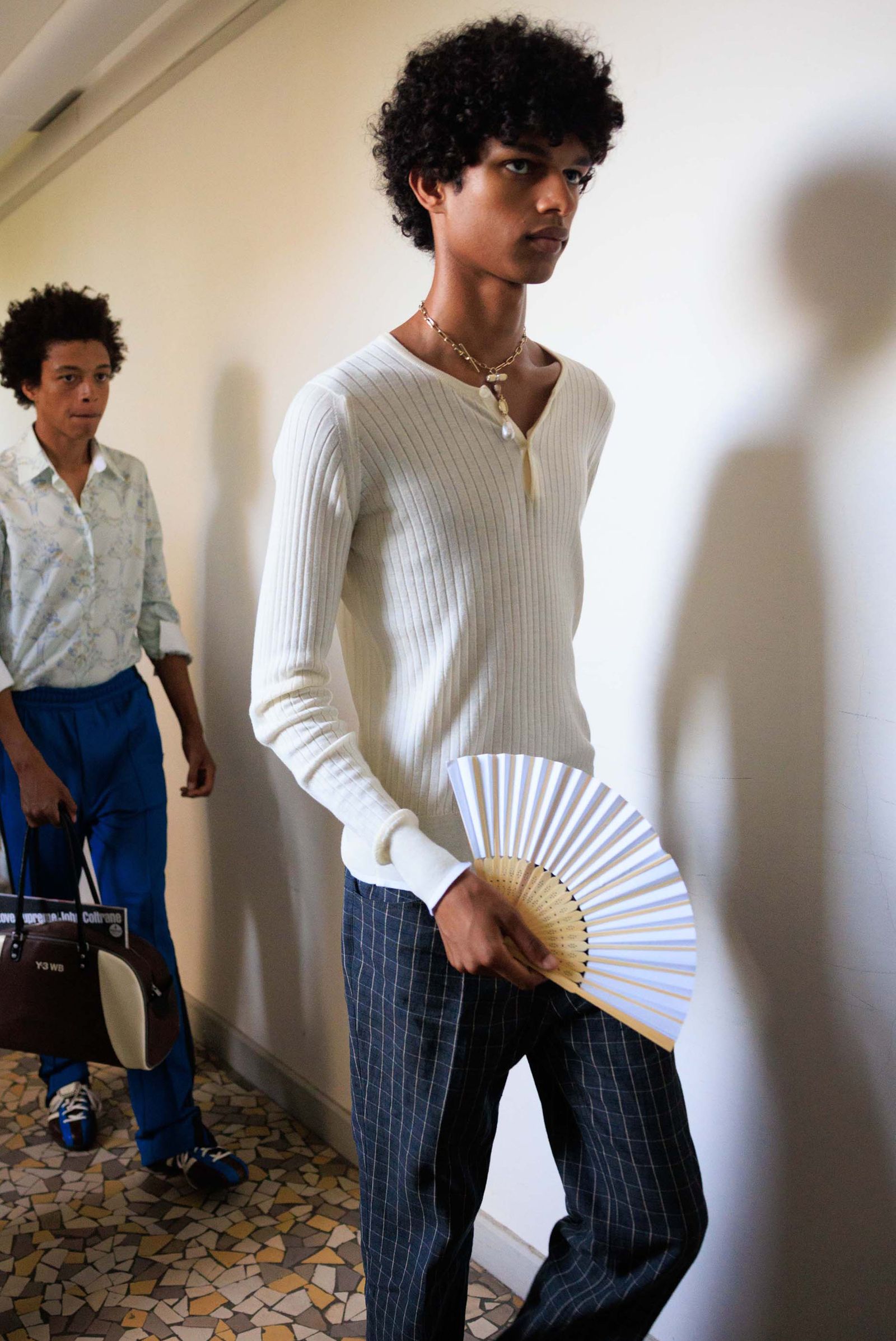 Image may contain Greg Eagles Clothing Sleeves Long Sleeve Men Youth Accessories Bag Handbag Head and Face