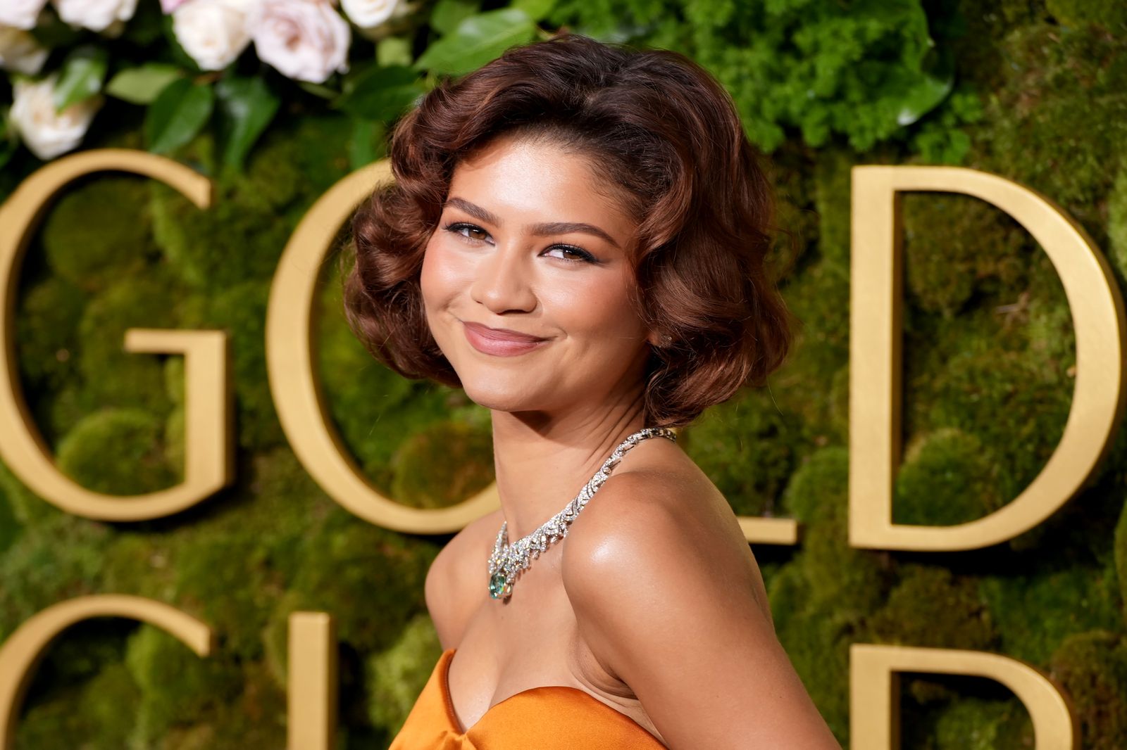 Image may contain Zendaya head, face, dimples, happy smile, body, part, neck and adult