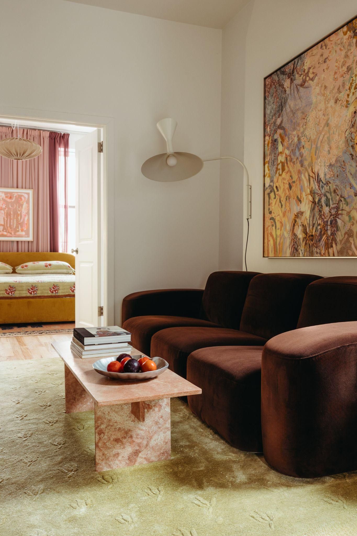 Image may contain home decor, sofa, furniture, table, architecture, architecture, interior, living room and coffee table