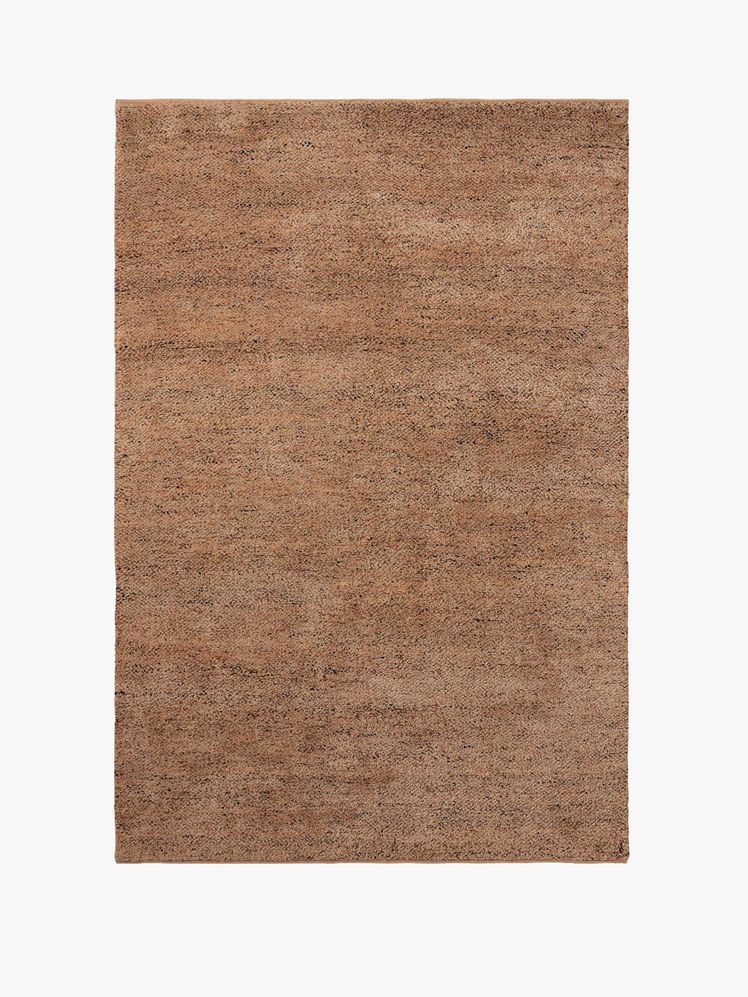 Image may contain: home decor, rug, books and publications