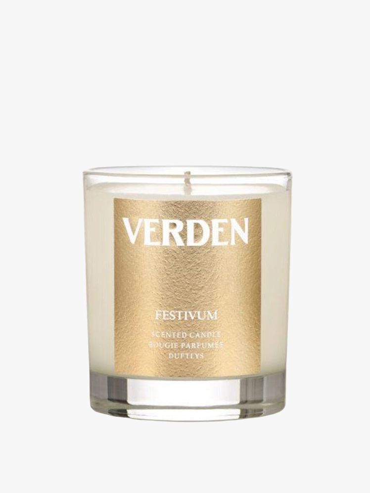 Image may contain: candle, head, person, face, cosmetics, bottle and shaker