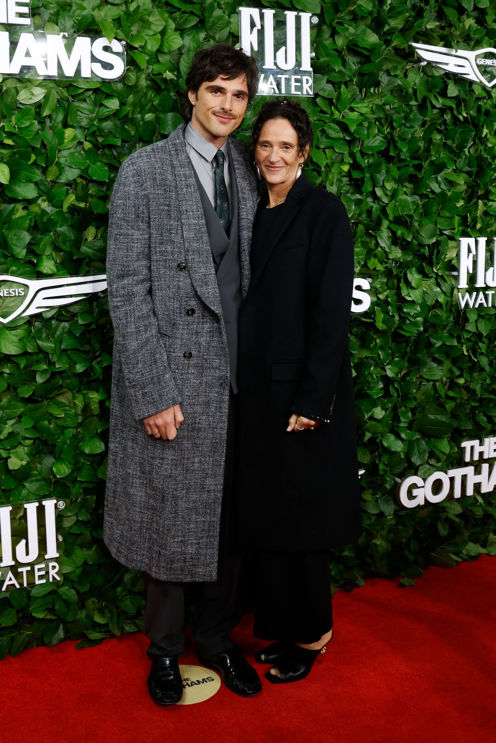 Image may contain fashionable clothing, adult coats and premieres