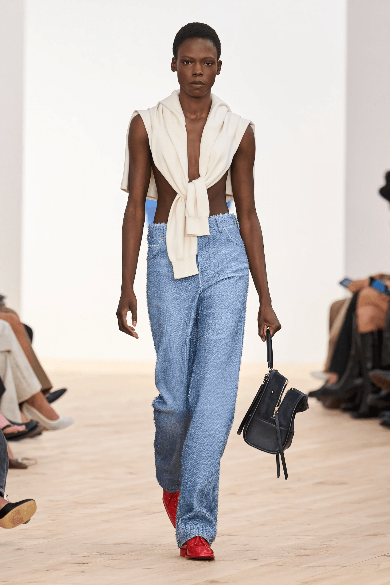 Image may contain Chaunt Lowe apparel, pants, jeans, fashion accessories, bags, handbags, adults and individuals