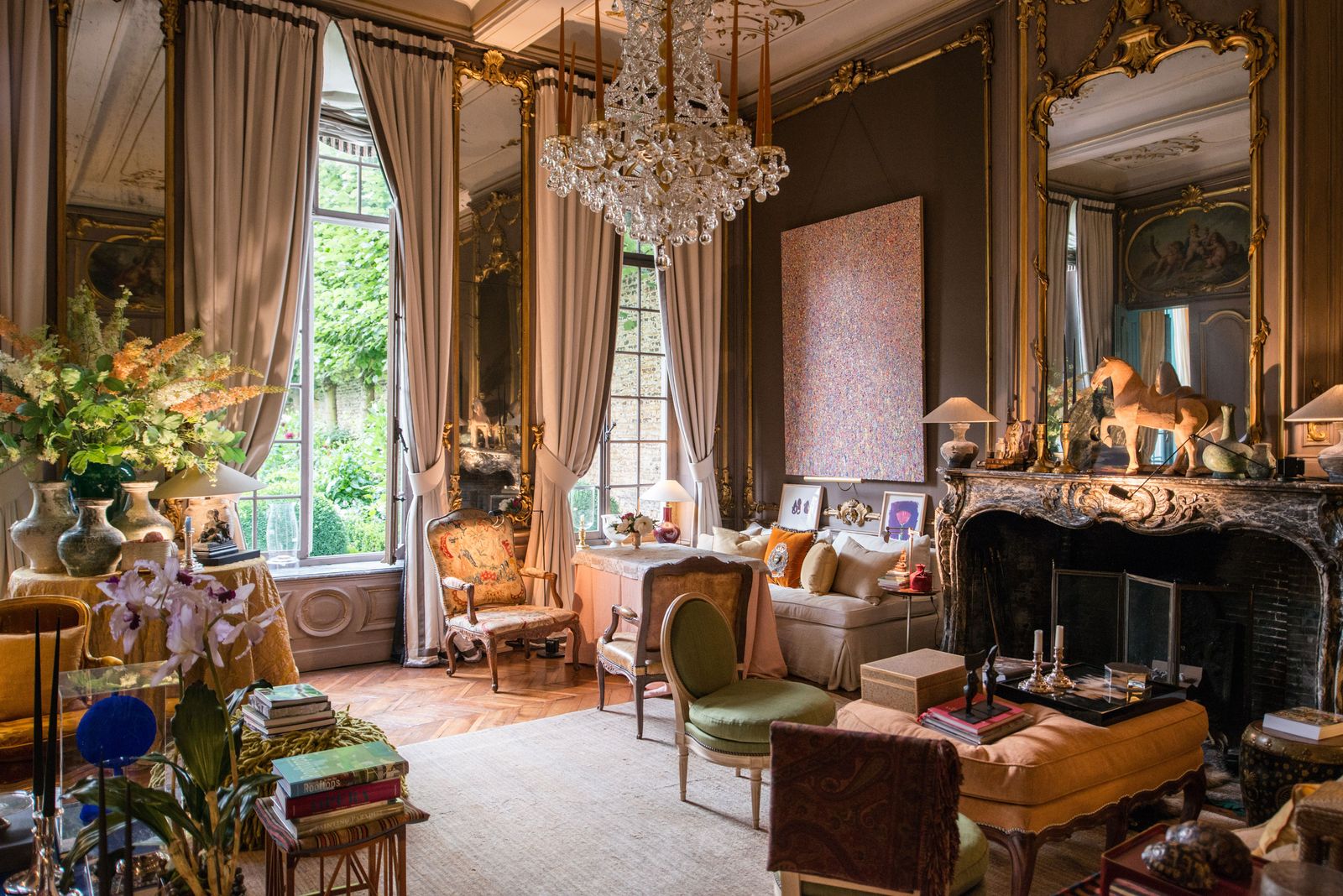 Image may contain home decor chandeliers, lamps, chairs, furniture and tables