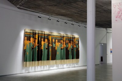 There are many people painted on the curtains.