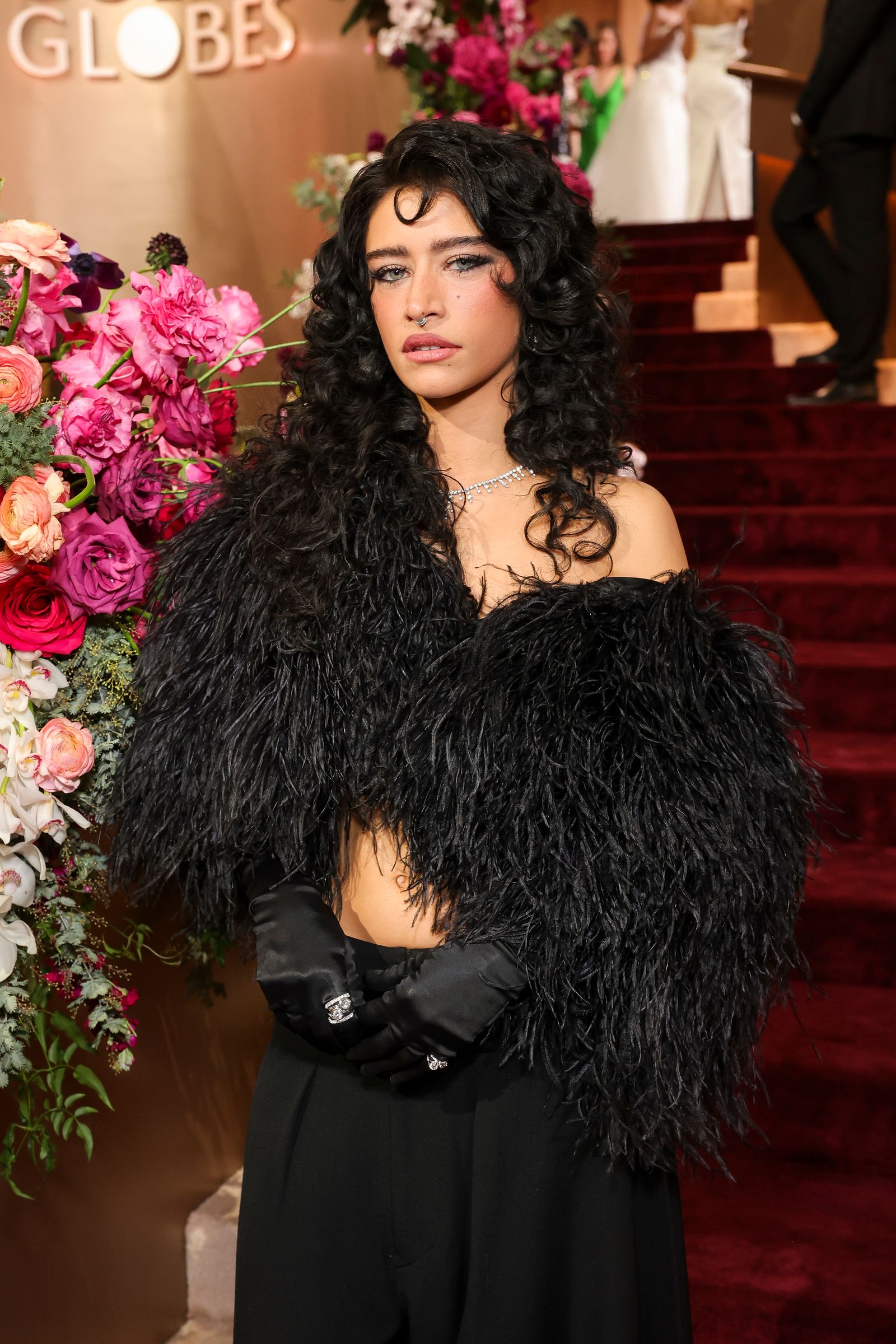 Image may contain adults, brunette, hair, clothing, gloves, curly hair and wedding