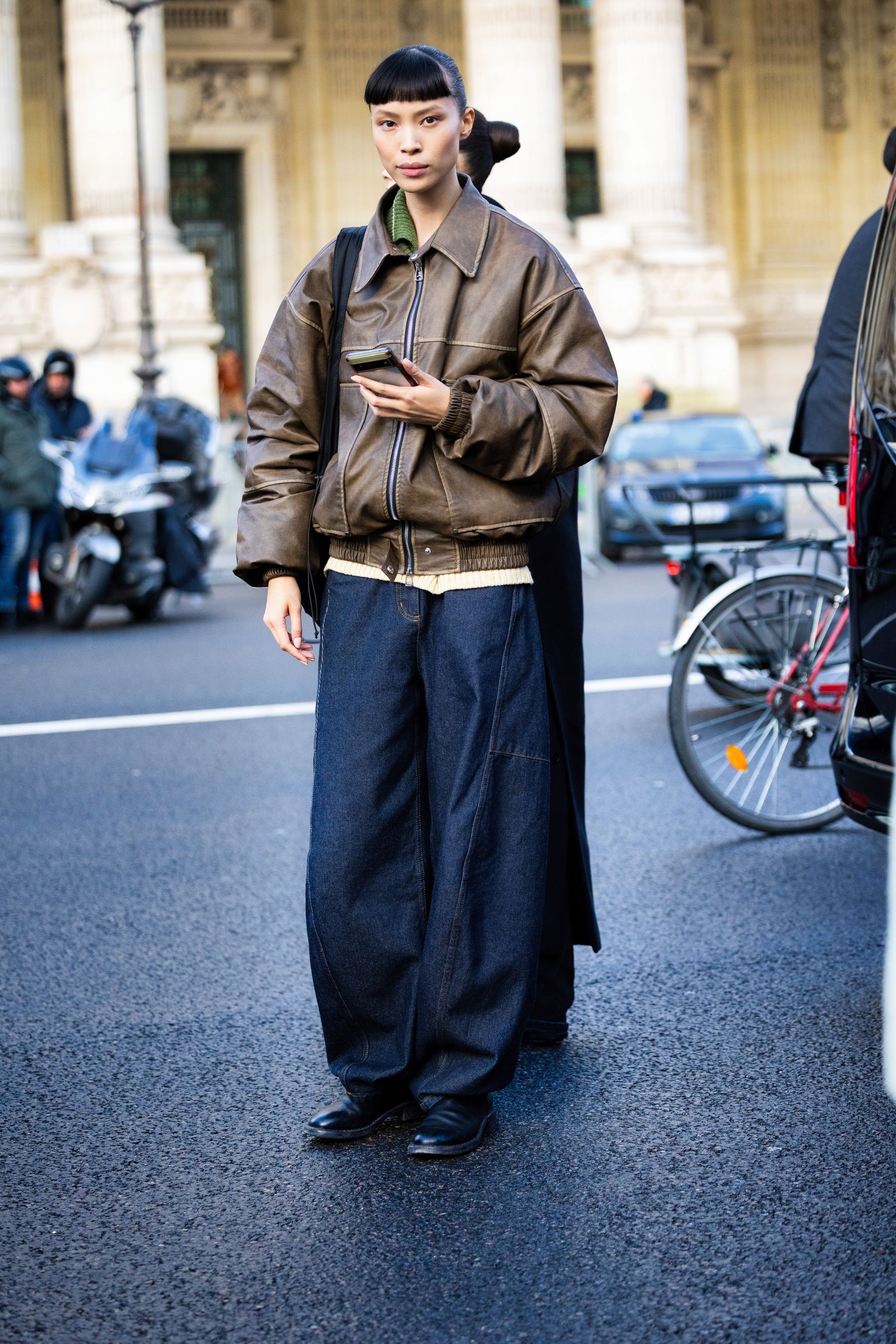 Image may contain Yukimi Nagano Christian Jones Caraun Reid clothing, pants, coats, standing jackets and adults