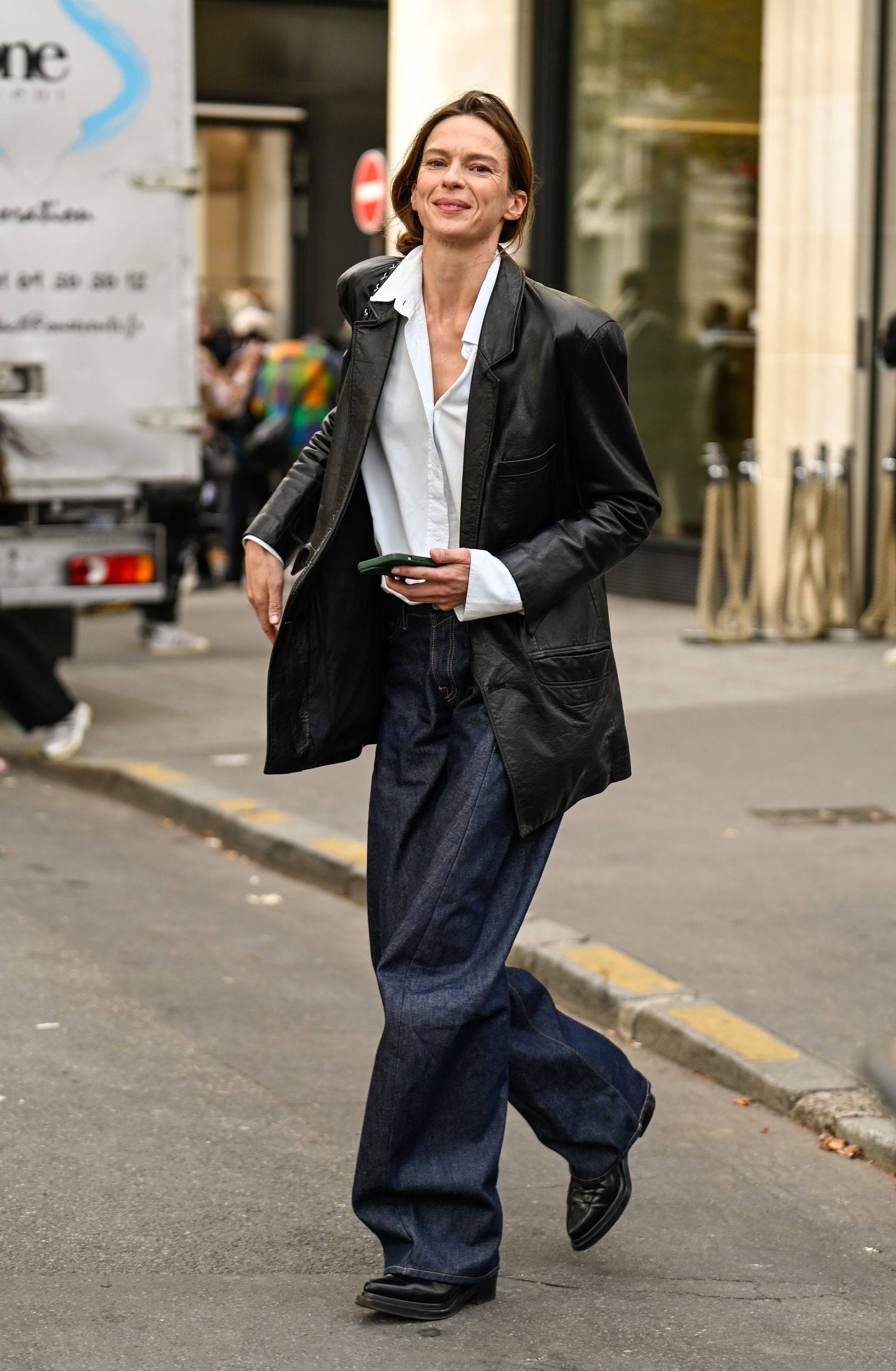 Image may contain Élise Crombez Clothing Coat Pants Jacket Blazer Pedestrian Adult Jeans Shoes