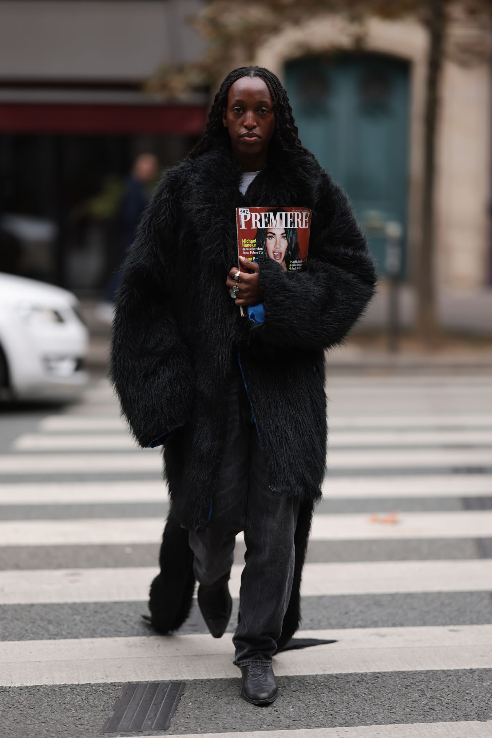 Image may contain Megan Fox pedestrian adult road tarmac clothing outerwear car transport vehicle and face