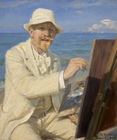A painter in a white suit and hat paints at his easel with the seaside behind him.
