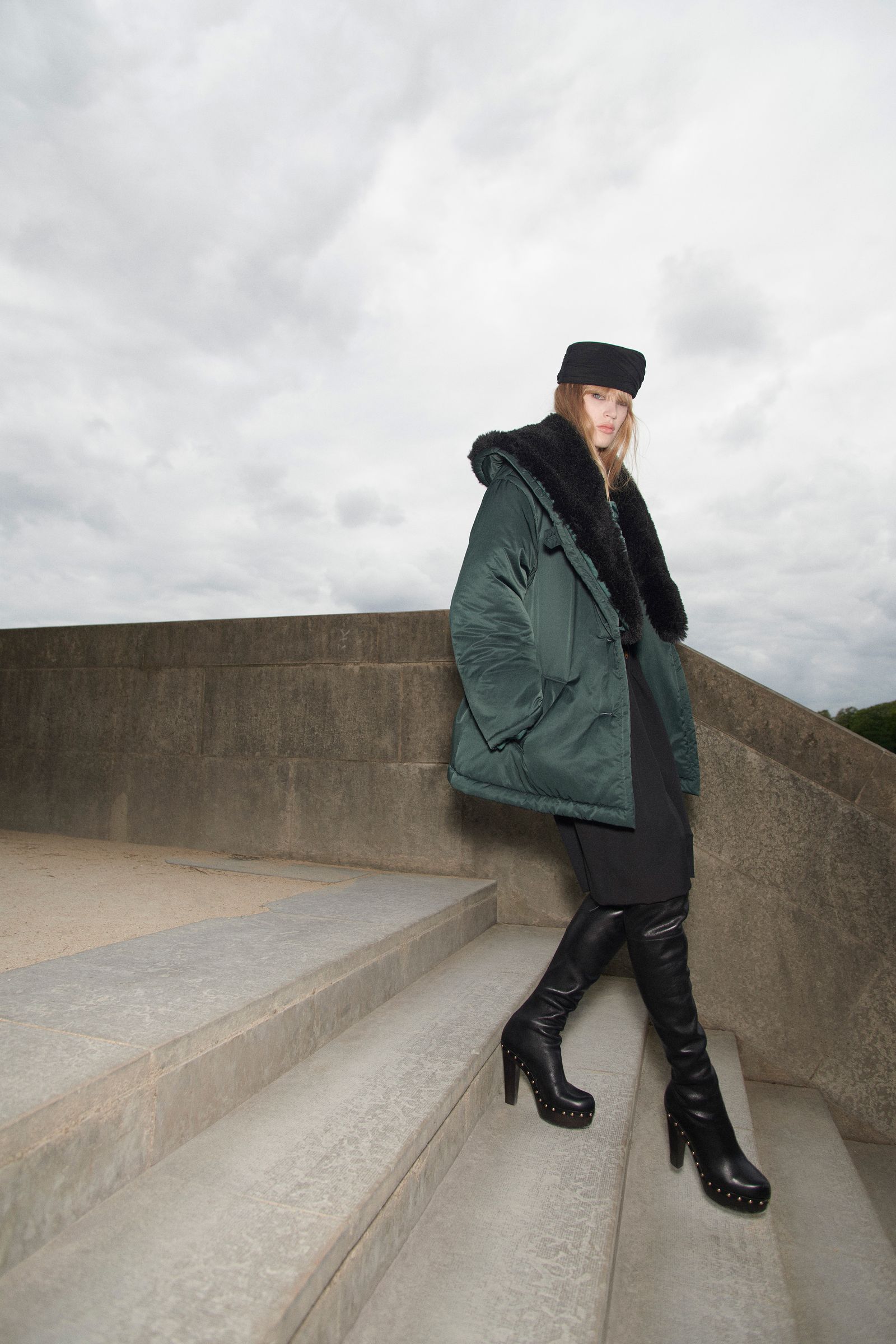 Pictures may contain clothing, coats, jackets, blazers, adult hats, footwear, shoes, faces, heads, photography and portraits