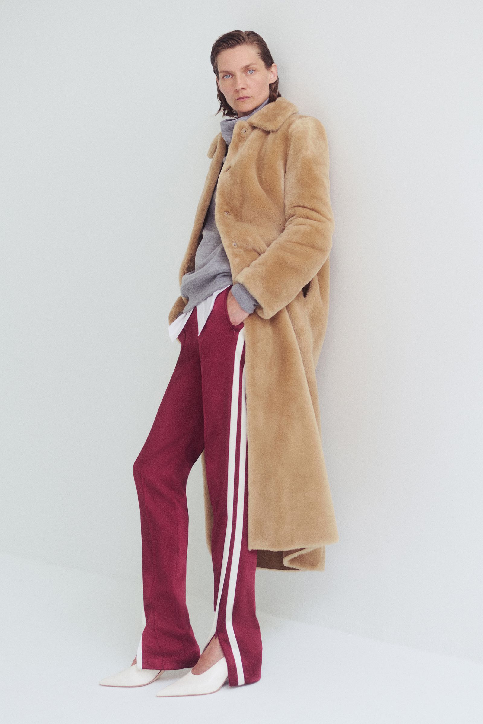 Image may contain clothing jackets and coats