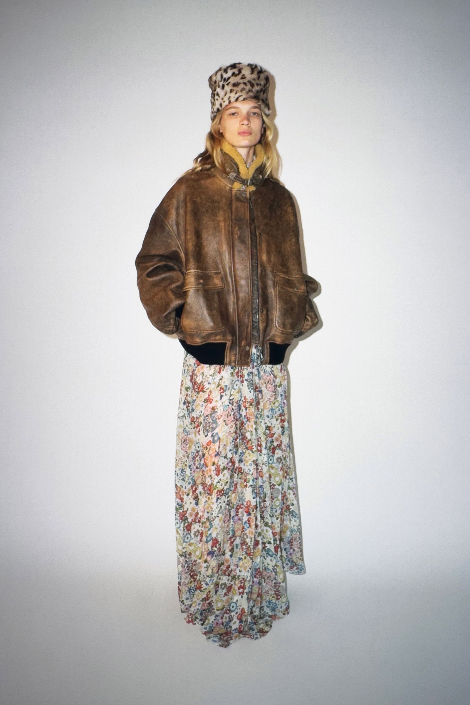 Image may contain clothing, coats, jackets, adults, skirts and hats