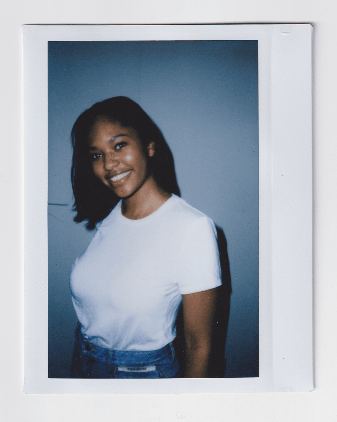 Image may contain happy head man smiling photography portrait clothing t-shirt, shirt, adult and pants