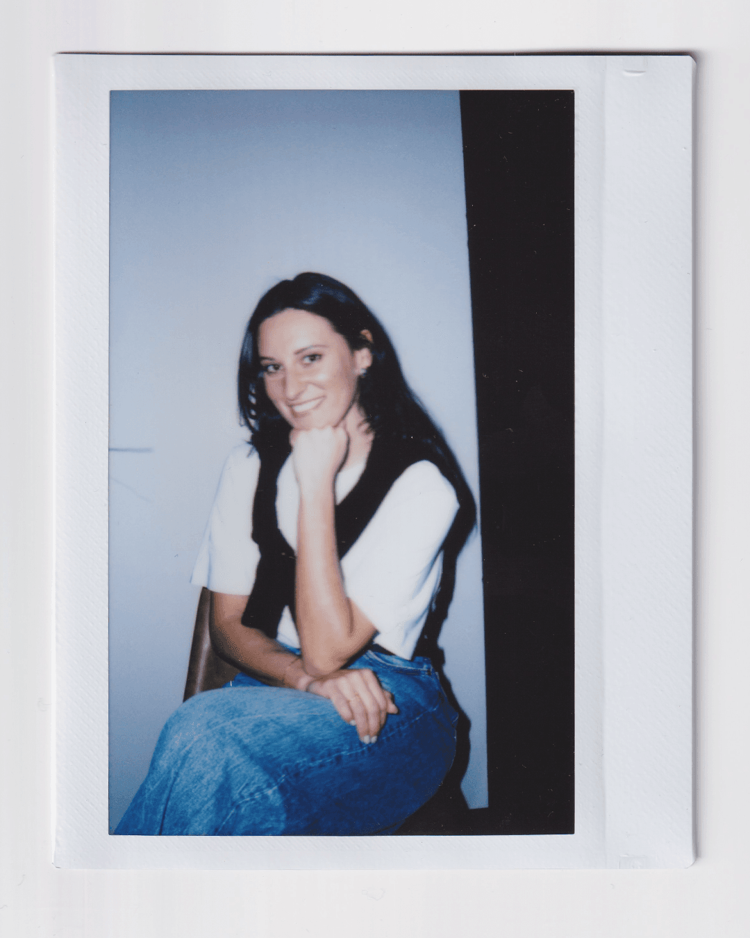 Image may contain clothing, pants, face, head, people photography, portrait, happy smile, jeans, sitting teen and shirt