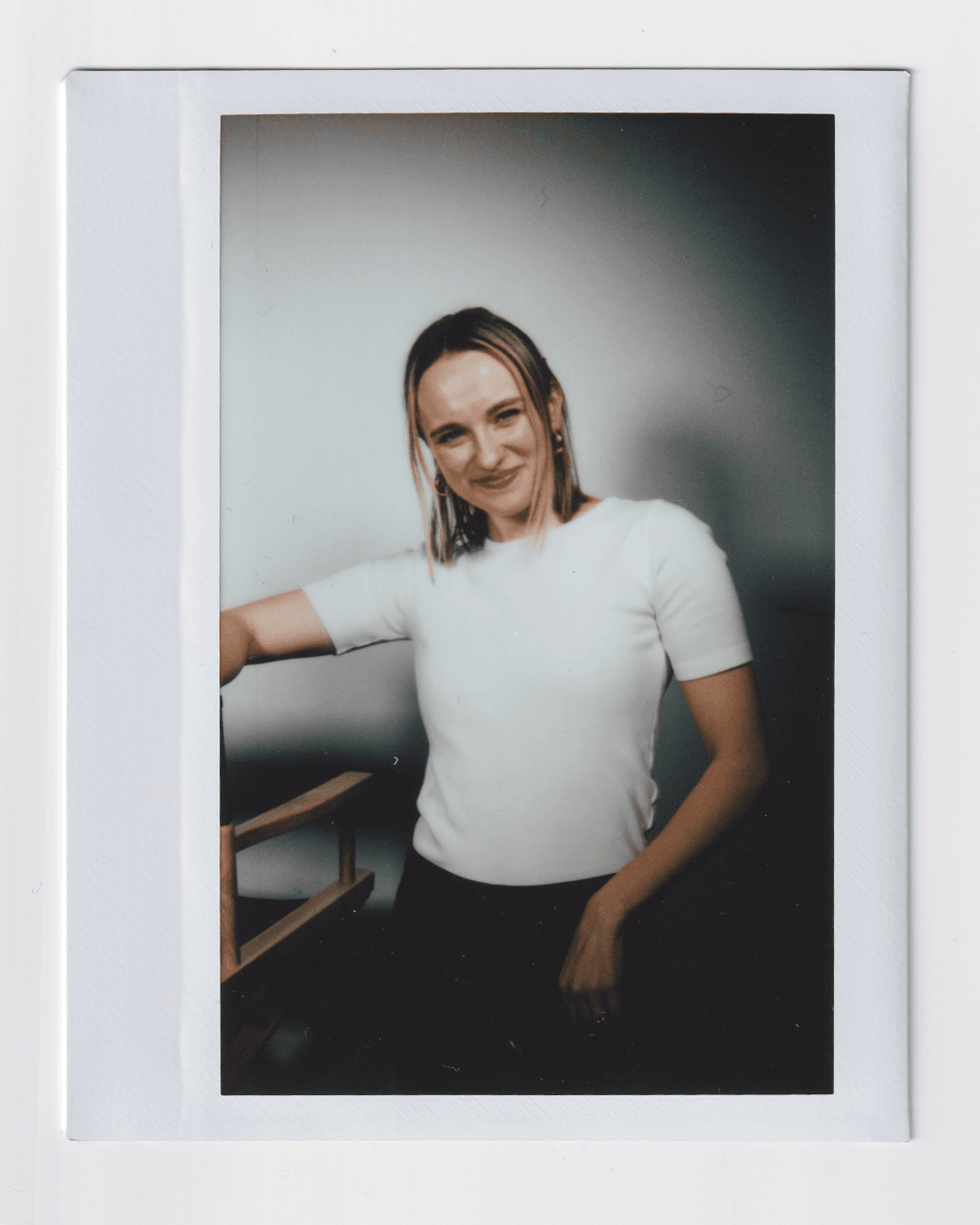 Image may contain Face Happy Head Person Smile Photography Portrait Shirt Clothing Long Sleeves and Sleeves