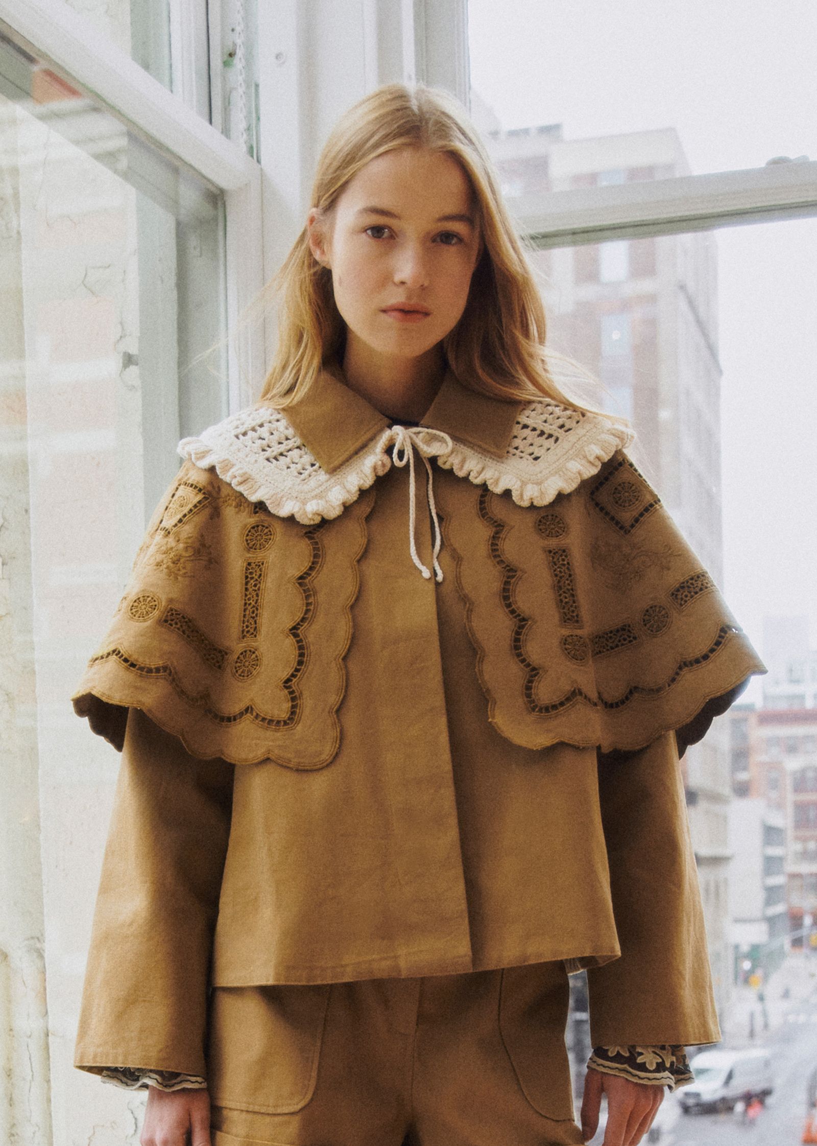 Image may contain Paula Kalenberg cape costume, fashion coat, shirt, children and people