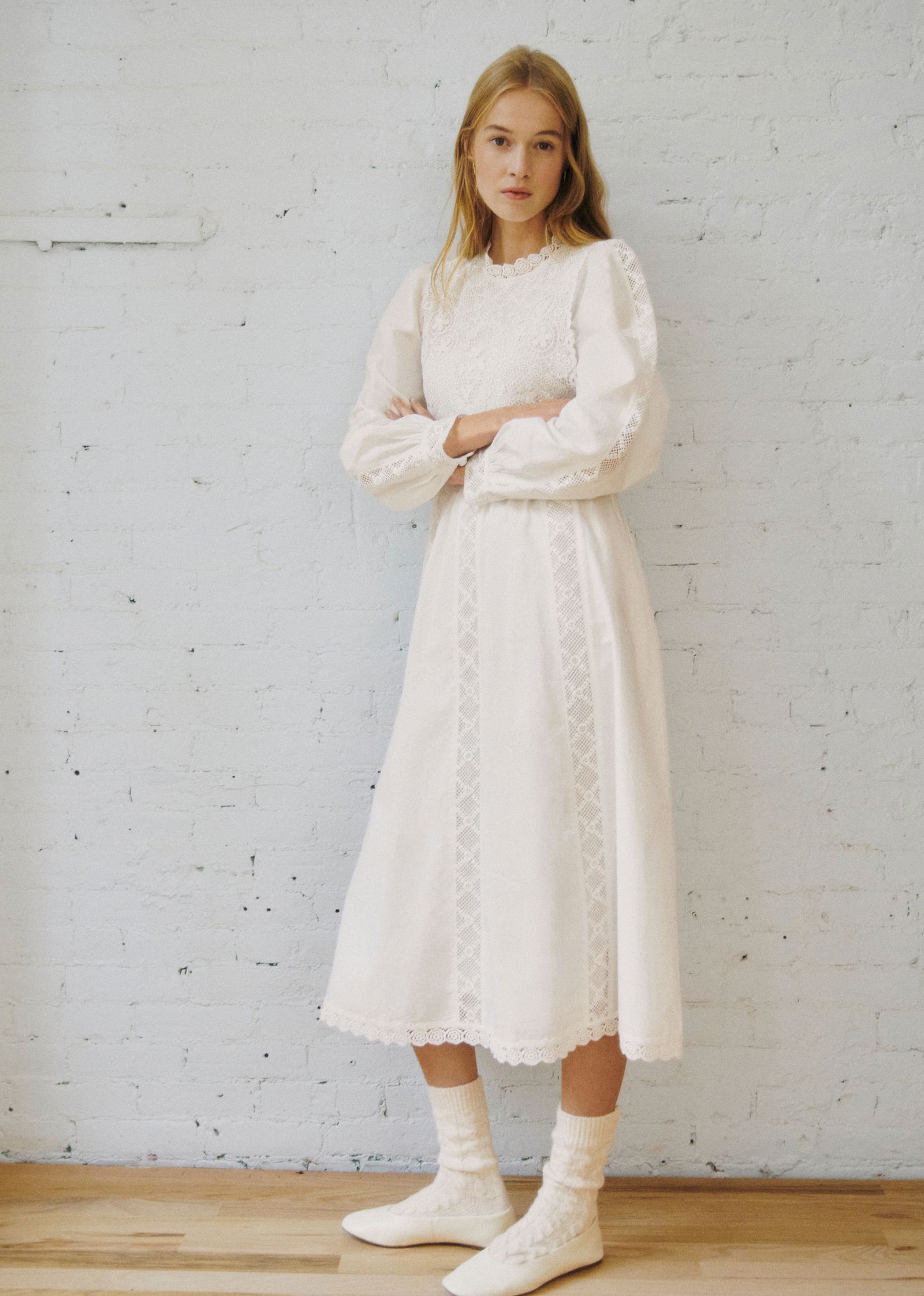 Image may contain clothing dress fashion formal dress wedding wedding dress long sleeves sleeves children and people