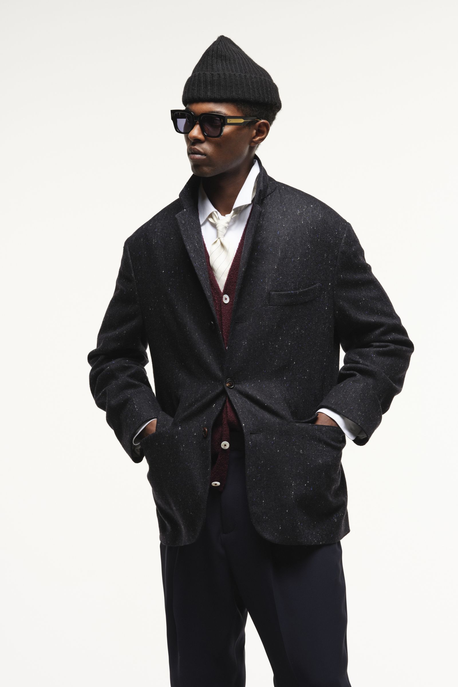 Image may contain blazers, coats, formal suits, adult accessories, glasses, coats and ties