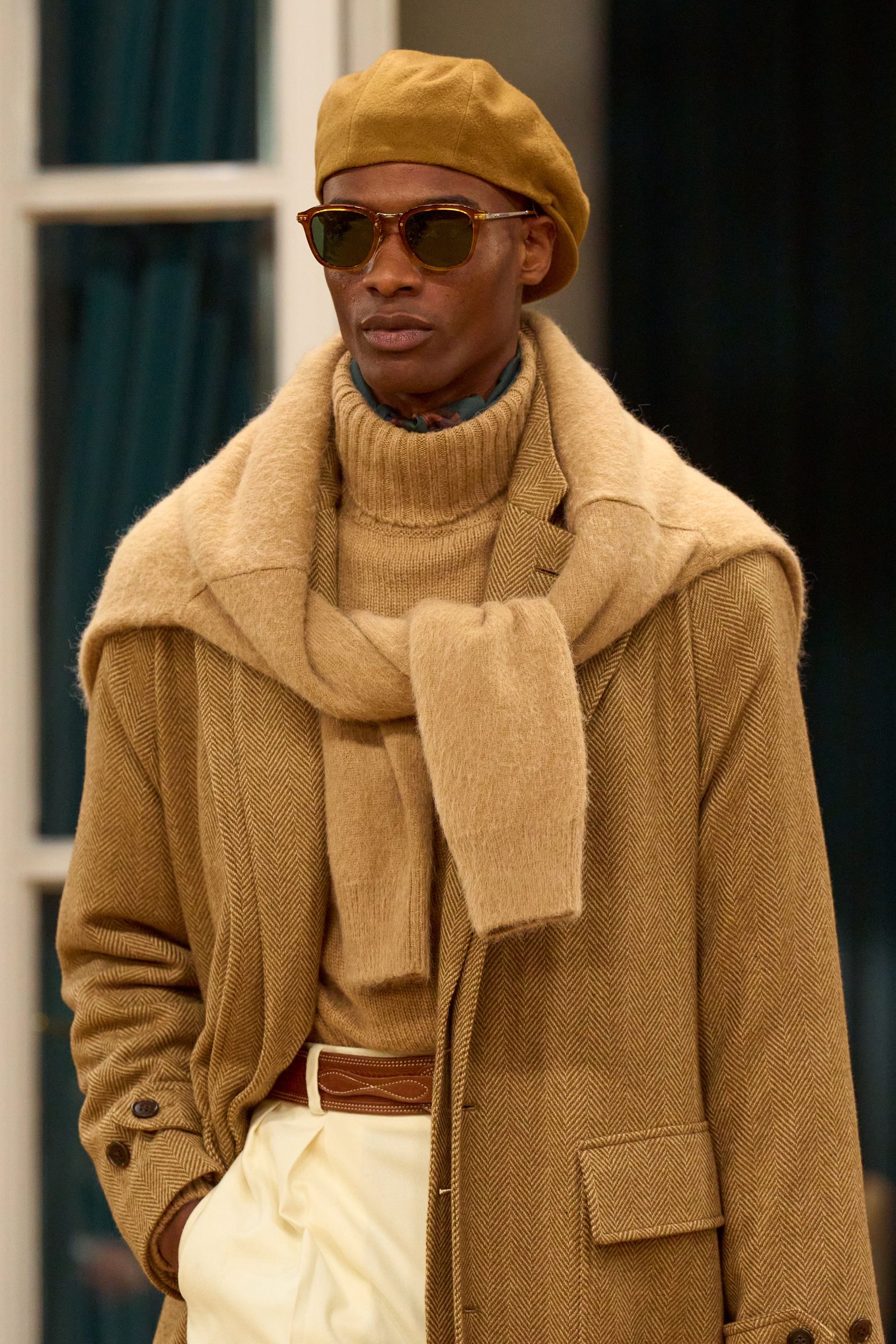 Image may contain clothing, coats, adults, accessories, sunglasses, faces and heads