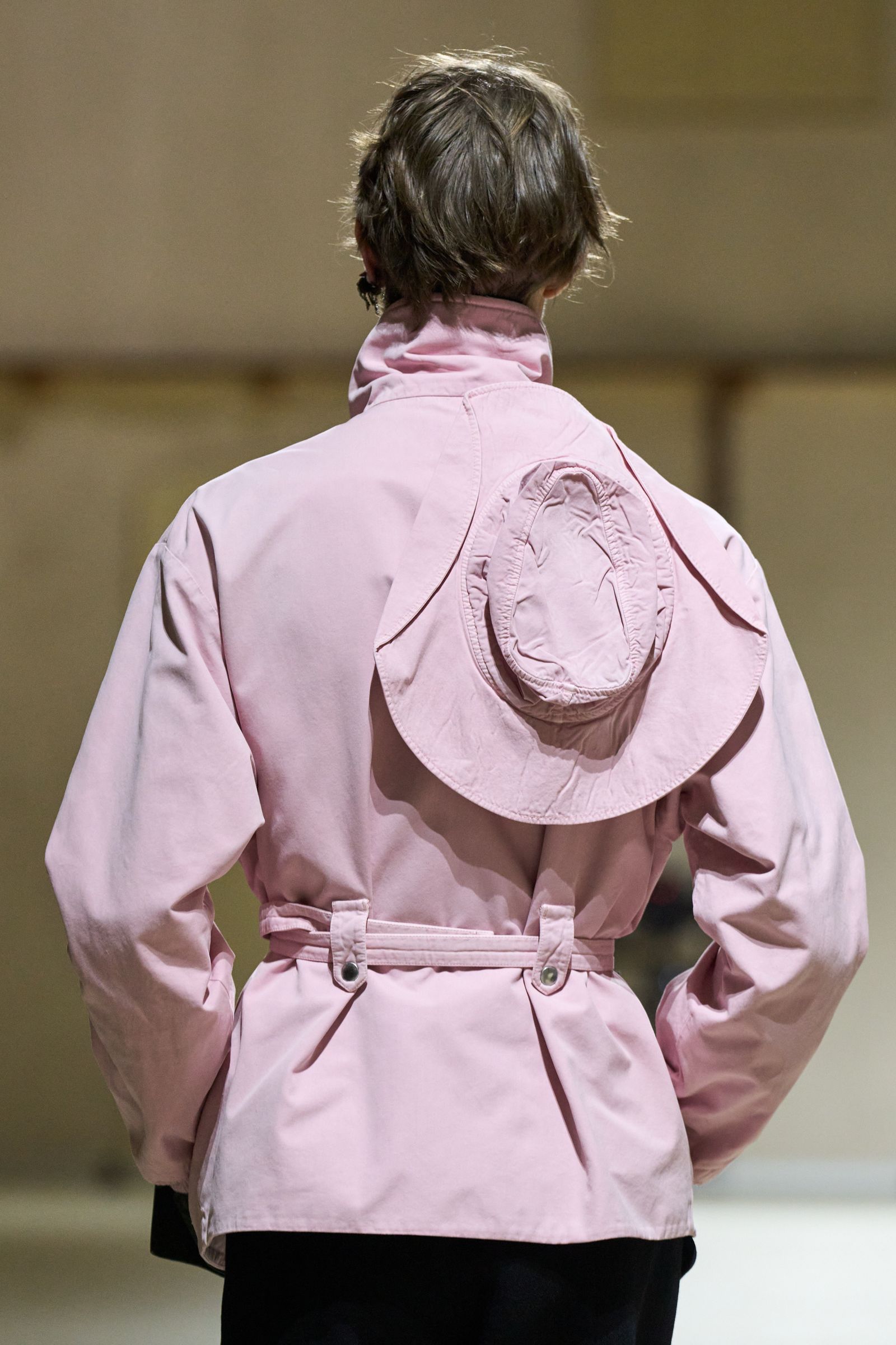 Image may contain clothing, outerwear, adults and coats