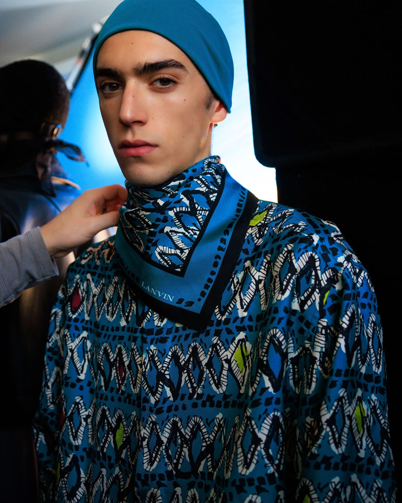 Image may contain hats, clothing, hats, adult headshot photography and portraits