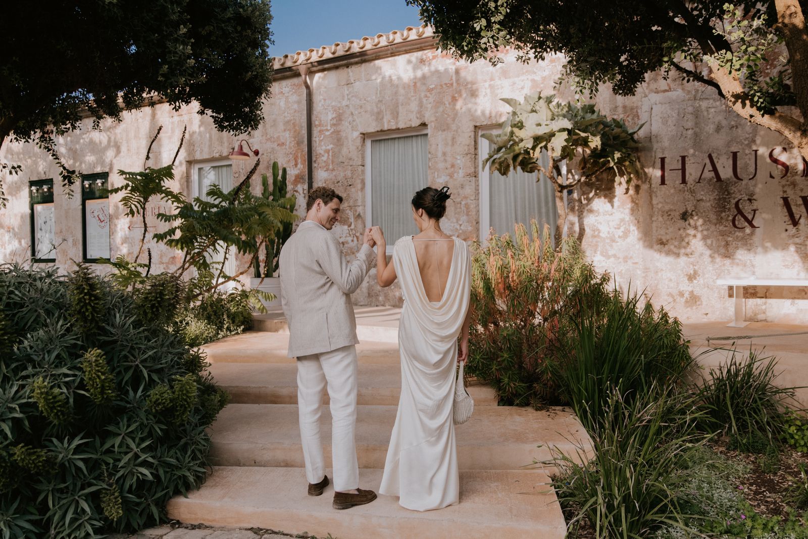 Image may contain plants, potted plants, adult weddings, body parts, hands, apparel, accessories and bags