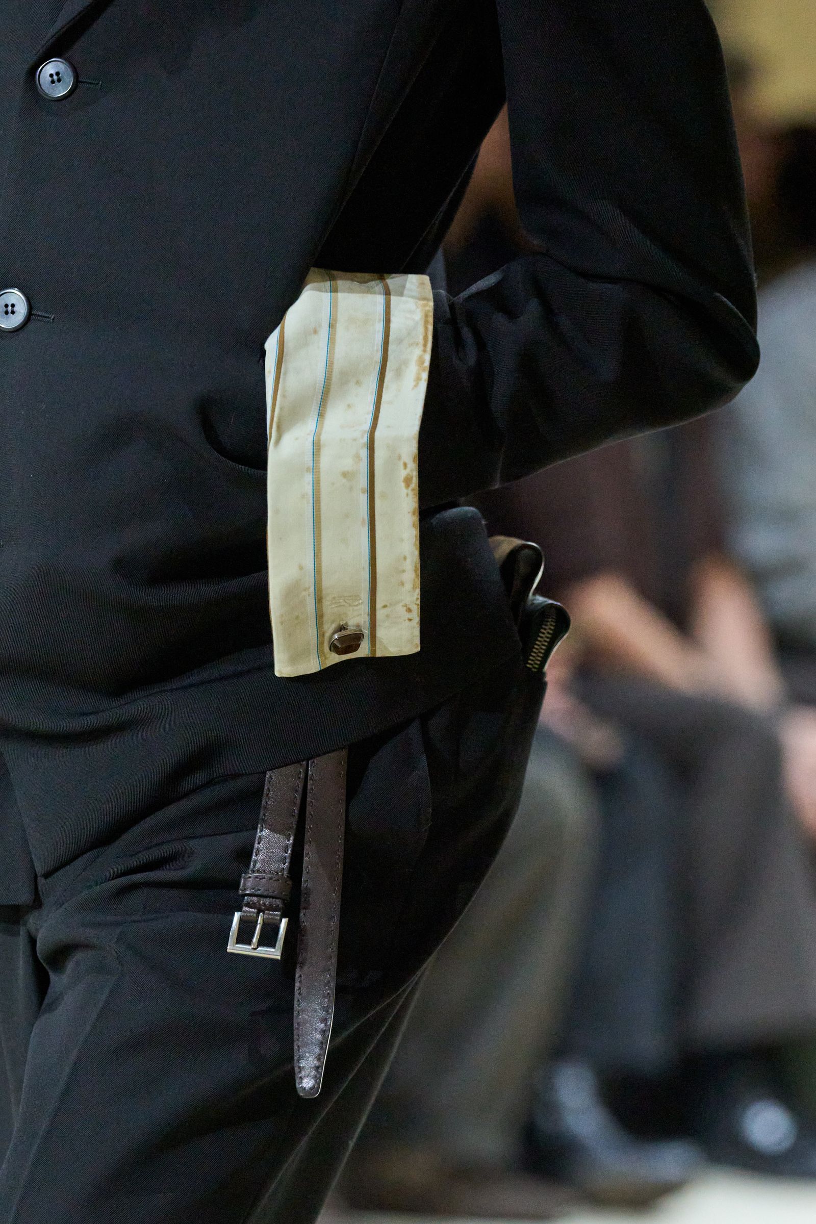 Image may contain accessories formal tie, outerwear, jacket, blazer, adult suit and belt