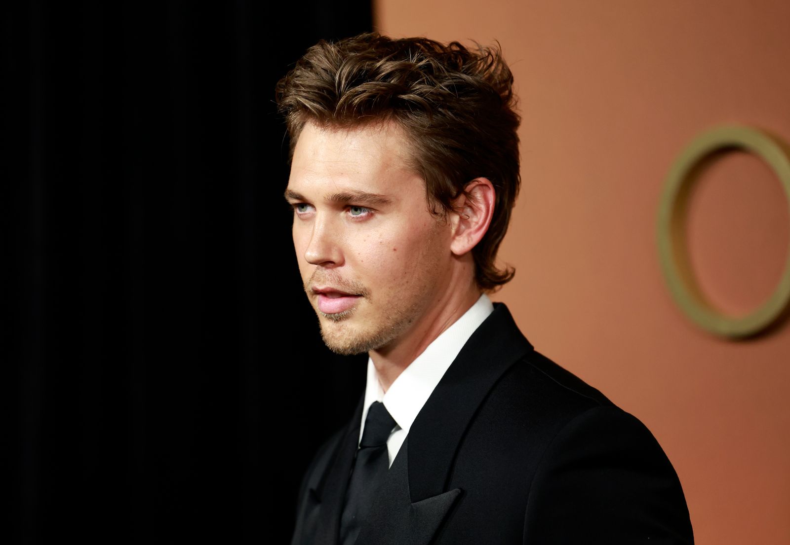 Image may contain Austin Butler clothing, formal wear, suit, face, head, people photography, portraits and accessories