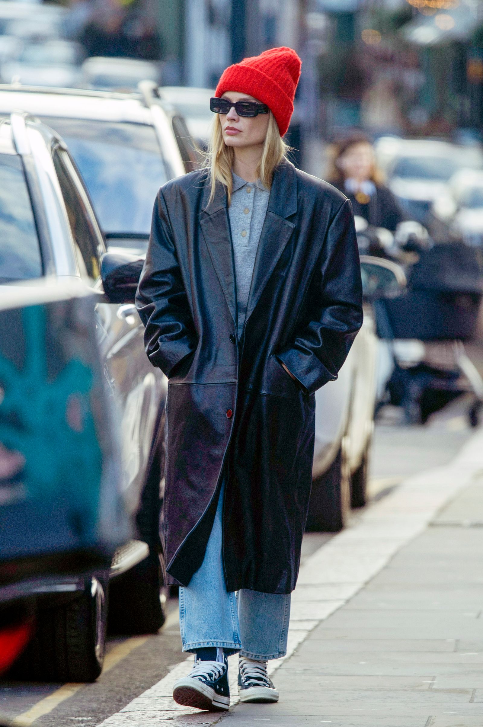 Image may contain Margot Robbie Clothing Coats Hats Jackets Adults Cars Traffic and Vehicles