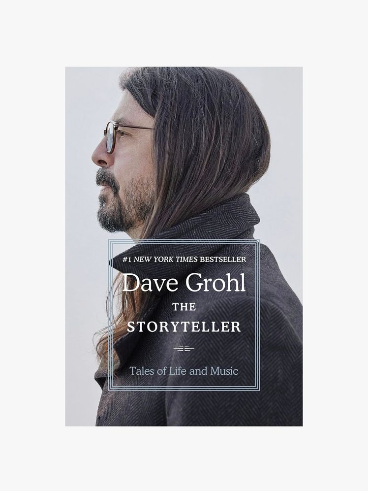 Image may contain: Dave Grohl, Face, Head, Person, Photography, Portrait, Clothing, Coat, Adult, Accessories, and Glasses