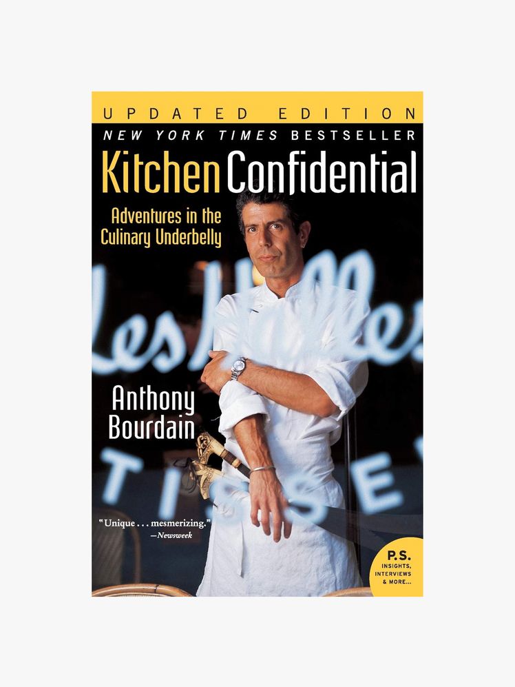 Image may contain: Anthony Bourdain, Publication, Adult, Person, Advertisement, Poster, Face, Head, Book, and Photography