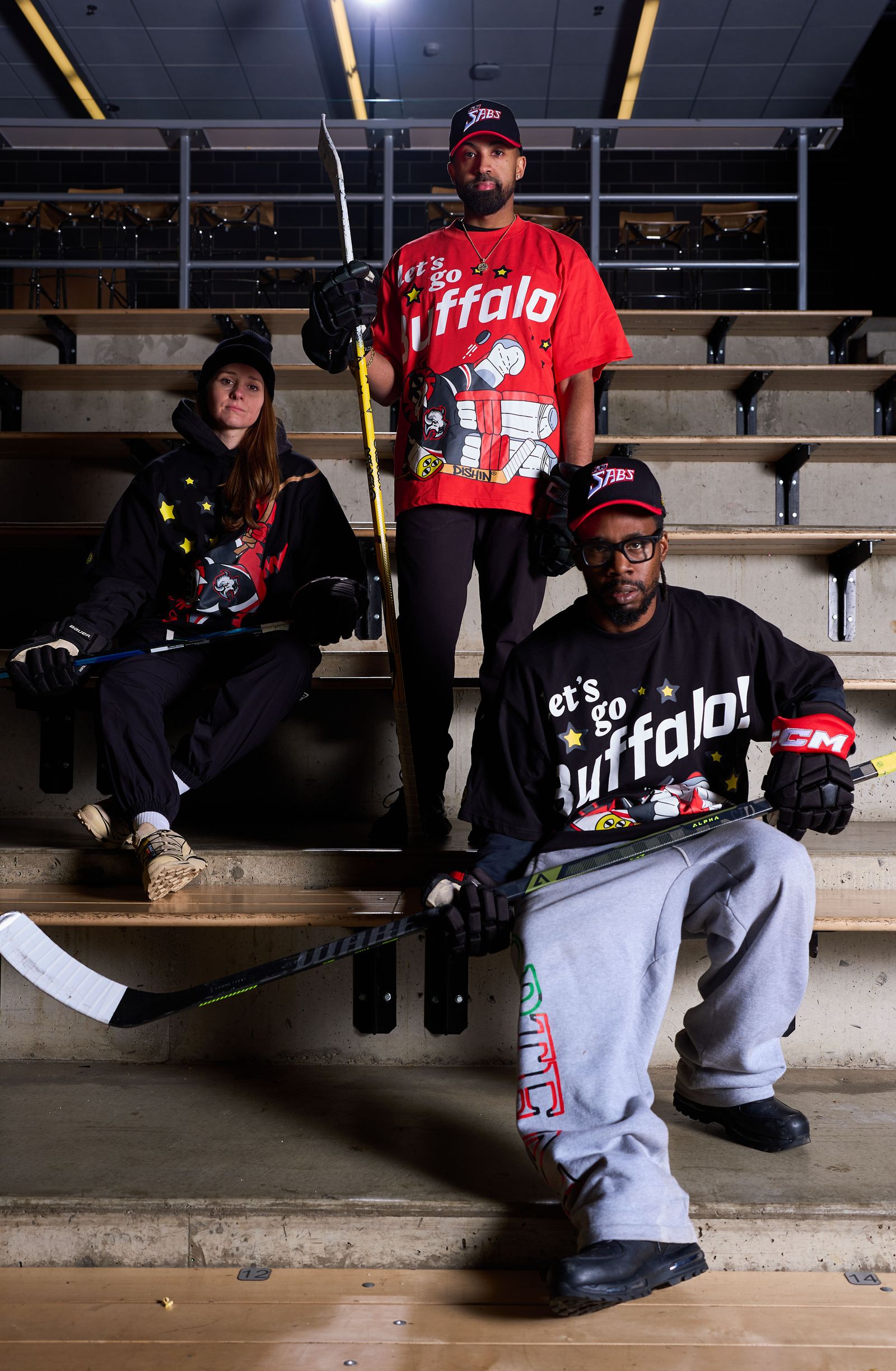 Image may contain people hockey hockey puck hockey stick skating rink sports baseball caps and hats