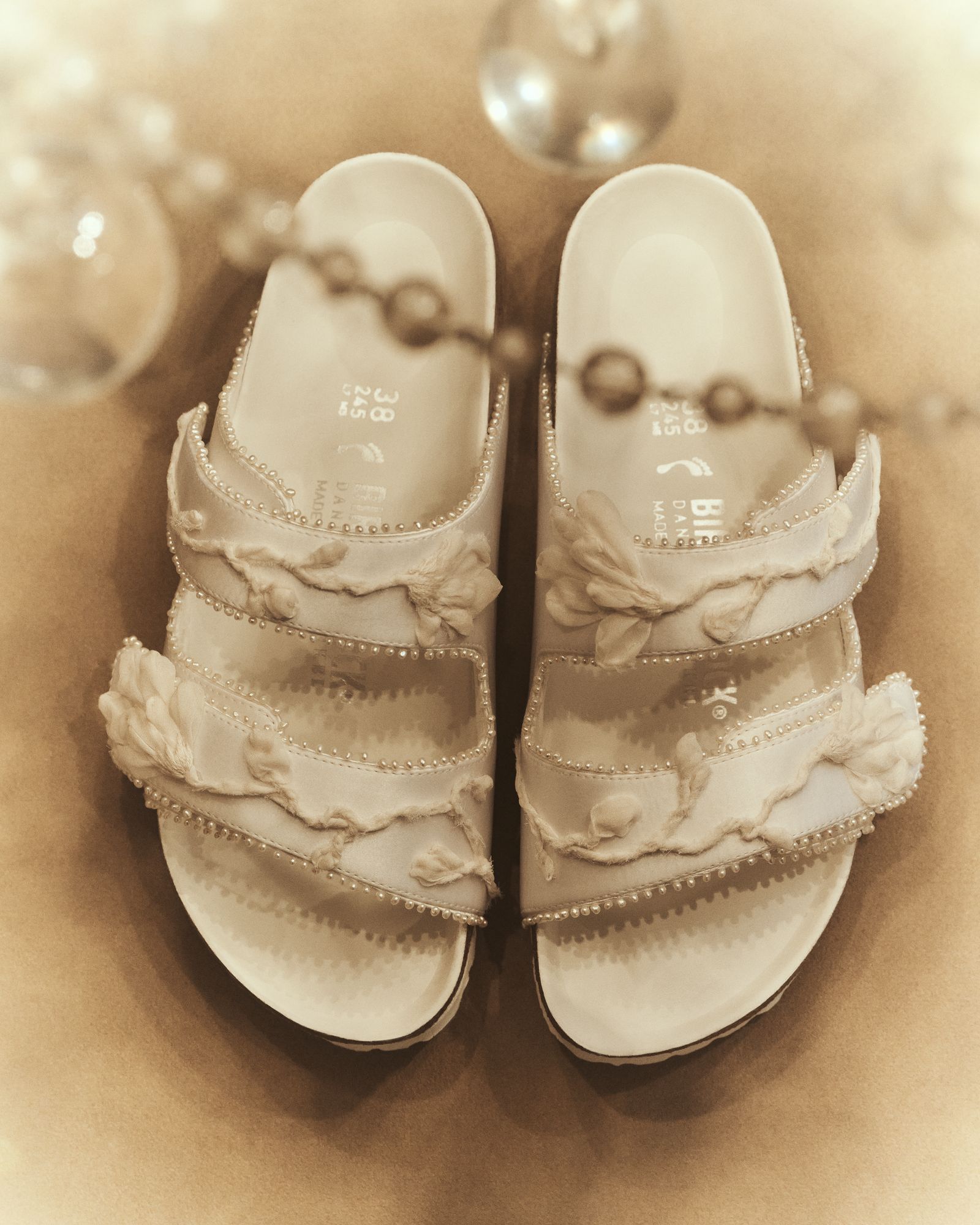 Image may contain clothing, footwear, sandals and sneakers