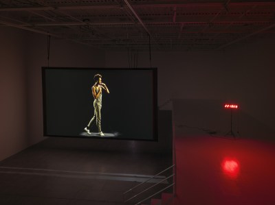 The screen shows a person walking next to a countdown clock.