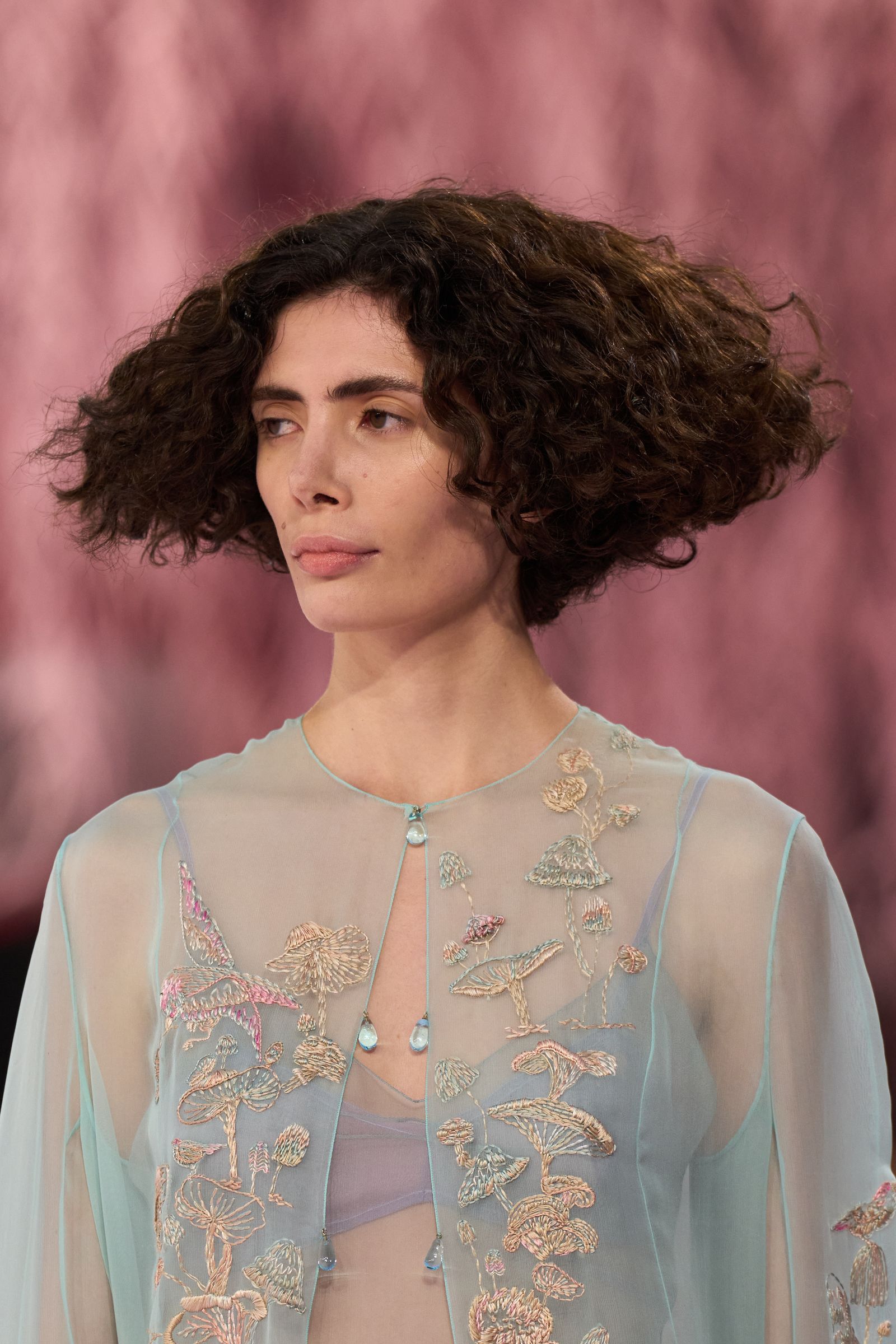 Image may contain Suzee Pai Hair Person Adult Curly Hair Accessories Jewelry and Necklace