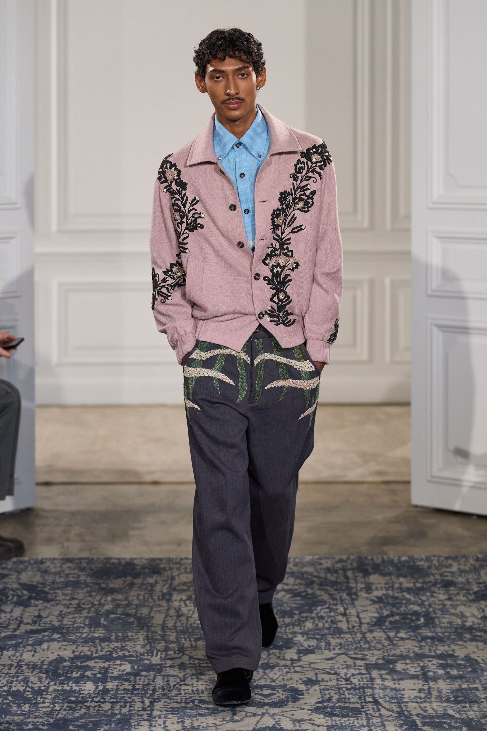 Image may contain Hrishikesh Pandey blazer, coat, jacket, pants, formal wear, suit, sleeves and standing