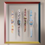 Four watches hang on the wall.