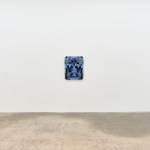 There are three paintings hanging on the wall.