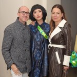 The three men smiled at the camera.