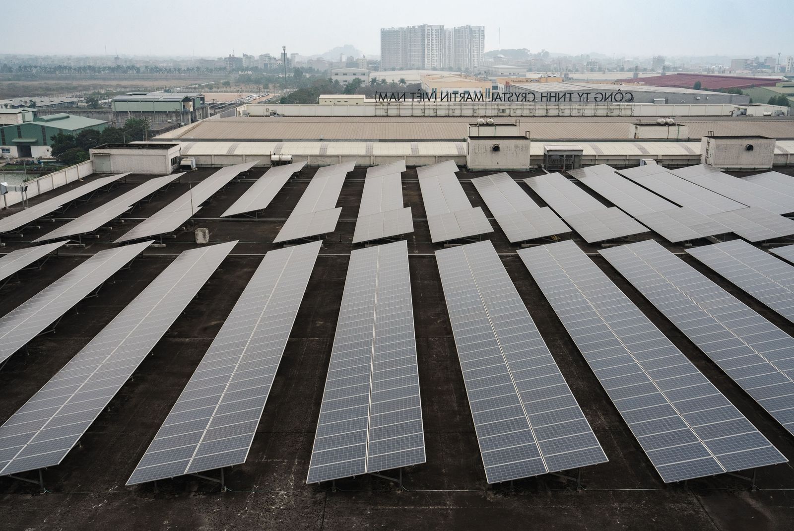 Image may contain outdoor electrical equipment, solar panels and aerial view