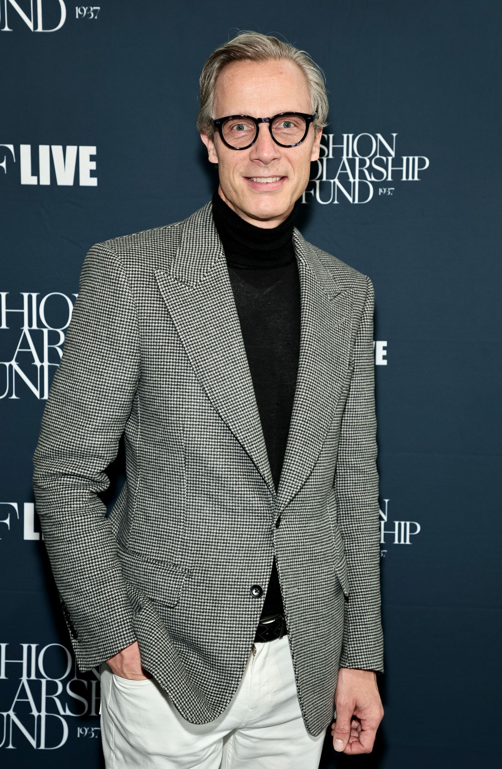 Image may contain Paolo Seganti clothing coat jacket blazer adult formal suit face happy and head