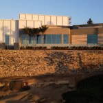 Aerial view of San Diego Museum of Contemporary Art building overlooking the beach and Pacific Ocean.