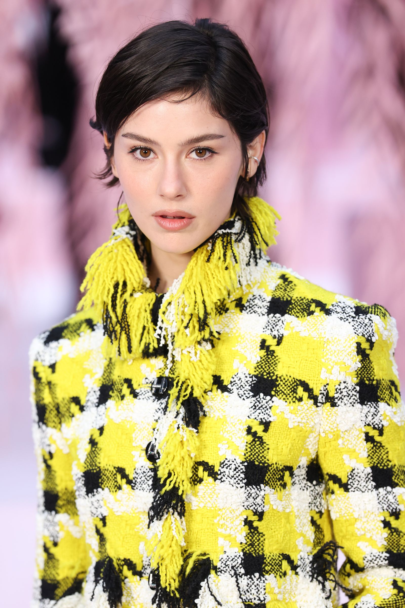 Image may contain faces, heads, people photography, portraits, black hair, hair, adult clothing and outerwear